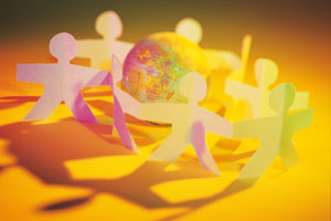 People paper chain around a globe